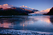 The Mendenhall Glacier and a frozen Mendenhall Lake basking the alpenglow of an Alaskan sunset.