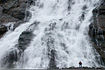 My best friend Scott, visiting from Colorado, poses in front of a huge waterfall located near the Mendenhall Glacier.